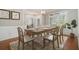 Elegant dining room with stylish furniture, wainscoting, and natural light at 402 Lake Point Trce, Canton, GA 30114