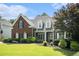 Charming brick home with well-maintained landscaping, featuring a welcoming entrance and classic architectural details at 402 Lake Point Trce, Canton, GA 30114