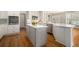 Modern kitchen with white cabinets, stainless steel appliances, and a spacious island at 402 Lake Point Trce, Canton, GA 30114