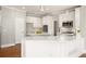 Modern kitchen with white cabinets, quartz countertops, and stainless steel appliances at 402 Lake Point Trce, Canton, GA 30114