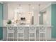 Charming kitchen with white cabinetry, stainless steel appliances, and breakfast bar seating at 402 Lake Point Trce, Canton, GA 30114