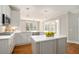 Stylish kitchen with gray island, stainless steel appliances, and ample counter space at 402 Lake Point Trce, Canton, GA 30114