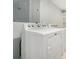 Bright laundry room featuring modern, white appliances at 402 Lake Point Trce, Canton, GA 30114