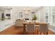 Cozy living and dining area featuring hardwood floors, a fireplace, and built-in shelving at 402 Lake Point Trce, Canton, GA 30114