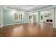 Spacious living room with hardwood floors, fireplace, abundant natural light, and view to other living areas at 402 Lake Point Trce, Canton, GA 30114