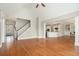 Spacious living room with hardwood floors, a fireplace with built-in shelves, and ample natural light at 402 Lake Point Trce, Canton, GA 30114