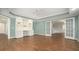 Inviting living area with hardwood floors, ceiling fan, custom built-ins, and adjacent rooms at 402 Lake Point Trce, Canton, GA 30114