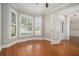 Inviting living room with hardwood floors, large windows with shutters, and elegant trim work at 402 Lake Point Trce, Canton, GA 30114