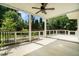 Covered patio featuring ceiling fan and backyard views at 402 Lake Point Trce, Canton, GA 30114