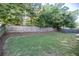Spacious backyard features a well-maintained lawn and a tall wooden fence at 4305 Huron Dr, Cumming, GA 30028