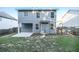 The backyard features a well-maintained lawn with a concrete patio, enclosed by a wood fence at 4305 Huron Dr, Cumming, GA 30028