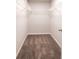 Spacious walk-in closet with carpet flooring and wire shelving for optimal storage at 4305 Huron Dr, Cumming, GA 30028
