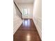 Foyer featuring dark wood floors, white walls with raised paneling and a staircase at 4305 Huron Dr, Cumming, GA 30028