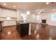 Open concept kitchen with granite countertops, stainless steel appliances, and hardwood flooring at 4305 Huron Dr, Cumming, GA 30028