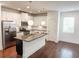 Modern kitchen featuring stainless steel appliances, granite countertops, and a center island at 4305 Huron Dr, Cumming, GA 30028