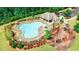 Aerial view of a community pool and playground featuring lounge chairs and manicured landscaping at 4305 Huron Dr, Cumming, GA 30028
