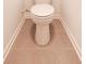 Powder room featuring a standard toilet with tile flooring and baseboard trim, for a clean, functional design at 4305 Huron Dr, Cumming, GA 30028