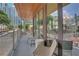Comfortable balcony with chairs and table with views of the city skyline at 775 Juniper Ne St # 327, Atlanta, GA 30308