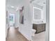 Modern bathroom with vanity, illuminated mirror, and wood-like tile flooring at 775 Juniper Ne St # 327, Atlanta, GA 30308