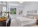 Bright bedroom with a cozy bed, stylish decor, and ample natural light at 775 Juniper Ne St # 327, Atlanta, GA 30308