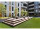 Outdoor courtyard with wood deck seating area and grass at 775 Juniper Ne St # 327, Atlanta, GA 30308