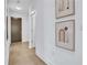 Hallway with hardwood flooring and modern artwork adorning the walls at 775 Juniper Ne St # 327, Atlanta, GA 30308