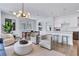 Bright living room showcases modern lighting, open layout to kitchen, and dining space at 775 Juniper Ne St # 327, Atlanta, GA 30308