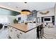 Open-concept lounge with a fireplace, modern kitchen and a stylish seating area at 775 Juniper Ne St # 327, Atlanta, GA 30308