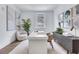 Well-lit office space featuring a white desk, modern artwork, and neutral tones at 775 Juniper Ne St # 327, Atlanta, GA 30308