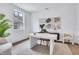 Bright home office features modern desk and chair with large window and contemporary decor at 775 Juniper Ne St # 327, Atlanta, GA 30308