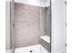 Modern shower featuring stylish tile work and a built-in bench at 775 Juniper Ne St # 327, Atlanta, GA 30308