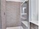 Modern shower with gray-toned tilework and bench seating at 775 Juniper Ne St # 327, Atlanta, GA 30308