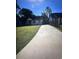 Expansive backyard showcasing a long driveway, surrounded by lush greenery and a well-maintained lawn, perfect for outdoor activities at 1132 Se Oak Knoll Se Ter, Atlanta, GA 30315