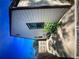 The side yard has a window, green foliage, grass and a concrete slab at 1132 Se Oak Knoll Se Ter, Atlanta, GA 30315