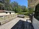 Wooden deck with seating overlooking the spacious backyard at 1272 Cave Springs Rd, Douglasville, GA 30134