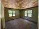Bedroom with natural light and textured ceiling at 1272 Cave Springs Rd, Douglasville, GA 30134