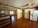 Kitchen with a bar, hardwood floors, and white appliances at 1272 Cave Springs Rd, Douglasville, GA 30134