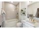 Bathroom features a tiled shower-tub, gold hardware, and a stylish sink and vanity at 2996 Treeside Ter, Marietta, GA 30066