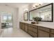 Stylish bathroom showcasing a double vanity with sleek hardware and access to a relaxing bedroom with a view at 2996 Treeside Ter, Marietta, GA 30066