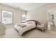 Charming bedroom features soft colors, a cozy bed, and natural light, creating a serene and inviting atmosphere at 2996 Treeside Ter, Marietta, GA 30066