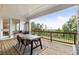 Covered deck with outdoor seating and scenic views of the surrounding trees and sky, perfect for relaxation at 2996 Treeside Ter, Marietta, GA 30066