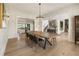 Stunning dining room showcasing an open layout, elegant lighting, and hardwood floors at 2996 Treeside Ter, Marietta, GA 30066