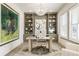 Stylish home office with custom built-ins, elegant lighting, and plantation shutters at 2996 Treeside Ter, Marietta, GA 30066