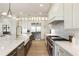 Modern kitchen with stainless steel appliances, a center island, and a farmhouse sink at 2996 Treeside Ter, Marietta, GA 30066