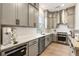 Stylish kitchen with stainless steel appliances, gray cabinets, white backsplash, and hardwood floors providing modern elegance at 2996 Treeside Ter, Marietta, GA 30066