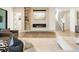 Elegant living room featuring a cozy fireplace, built-in shelving, and beautiful hardwood floors at 2996 Treeside Ter, Marietta, GA 30066