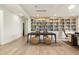 Open-concept living room featuring custom bookshelves, hardwood floors, and an airy layout, ideal for entertaining at 2996 Treeside Ter, Marietta, GA 30066