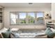 Cozy living room offers large windows with scenic views and comfortable seating, perfect for relaxation at 2996 Treeside Ter, Marietta, GA 30066