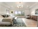 Bright main bedroom with tray ceiling, light hardwood floors, decorative rug, and view of mature trees at 2996 Treeside Ter, Marietta, GA 30066