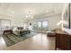 Expansive main bedroom featuring tray ceilings, beautiful views, and an ornate chandelier above the bed at 2996 Treeside Ter, Marietta, GA 30066